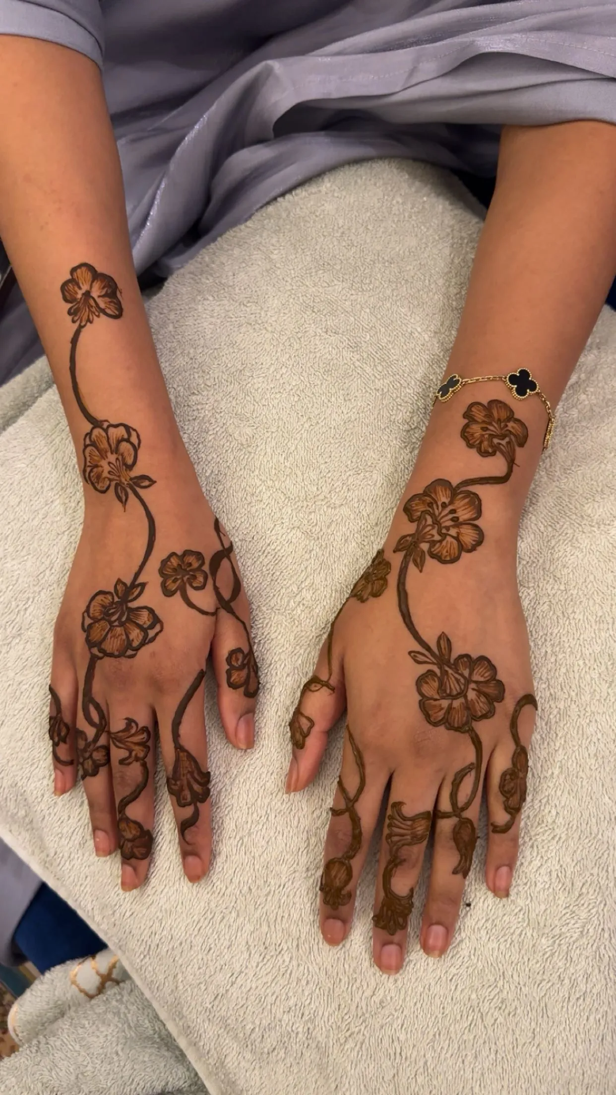 Trailing blossom henna from wrist to fingers
