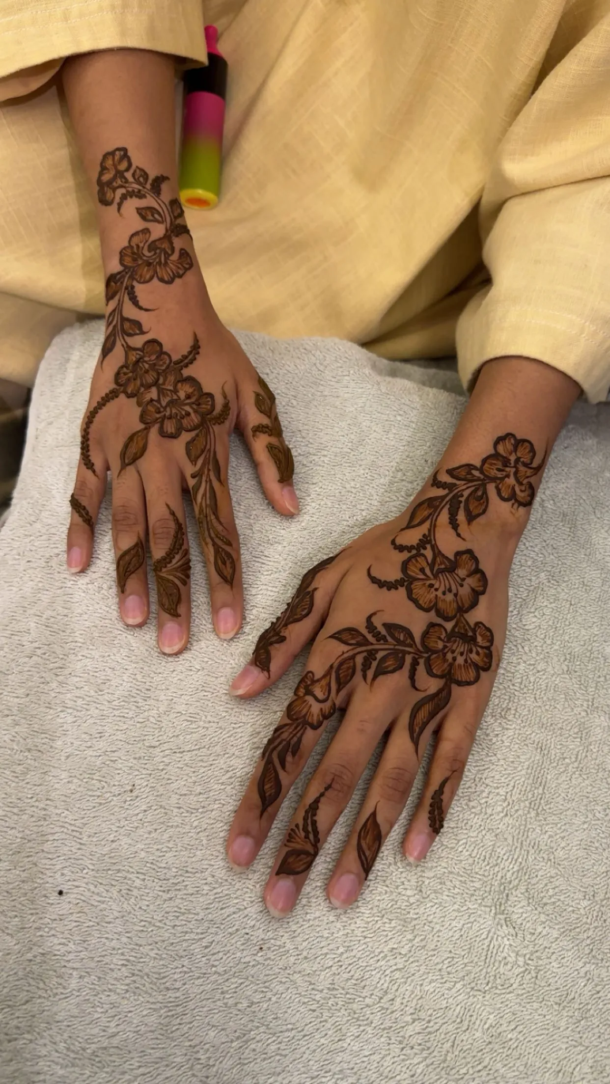 Bold tropical floral henna on both hands